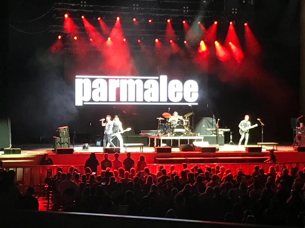 Parmalee band performing live on stage under the open gates at The Orion Amphitheater