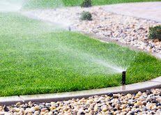 Automatic sprinklers watering lawn